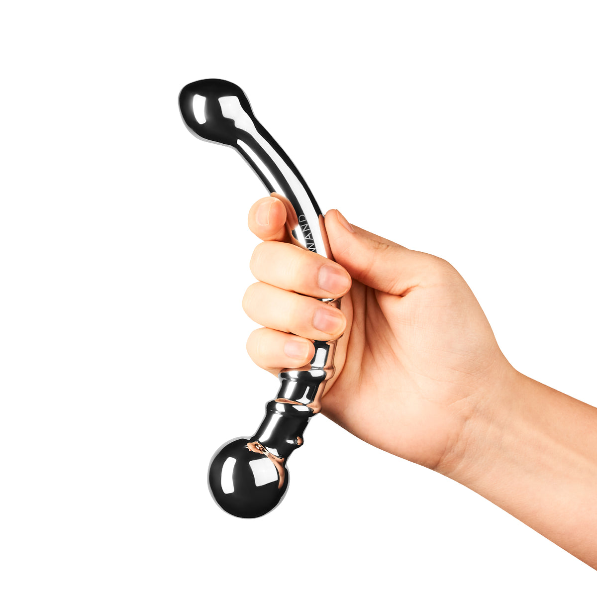 Hand holding a Le Wand Bow solid stainless steel wand with dual-ended curve against a white background