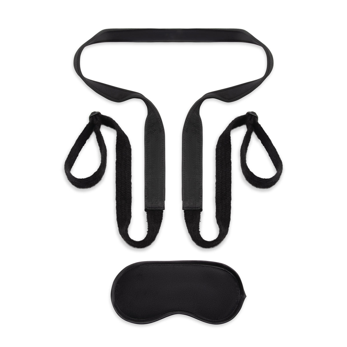 Black bondage set with restraint and eye mask on a white background