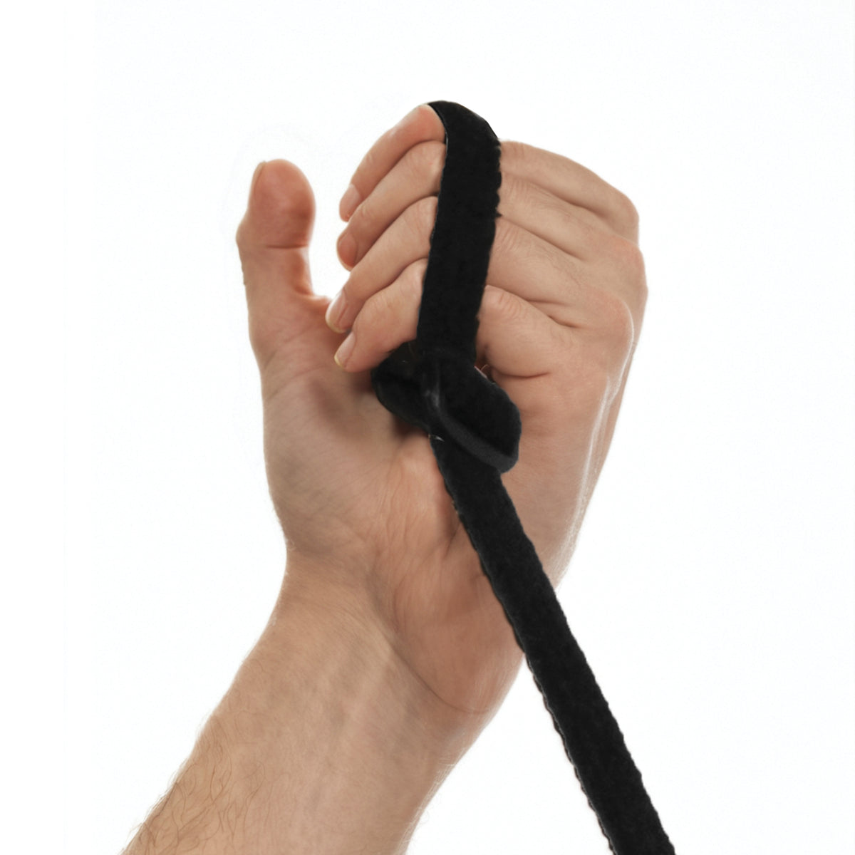 Hand holding a black strap against a white background