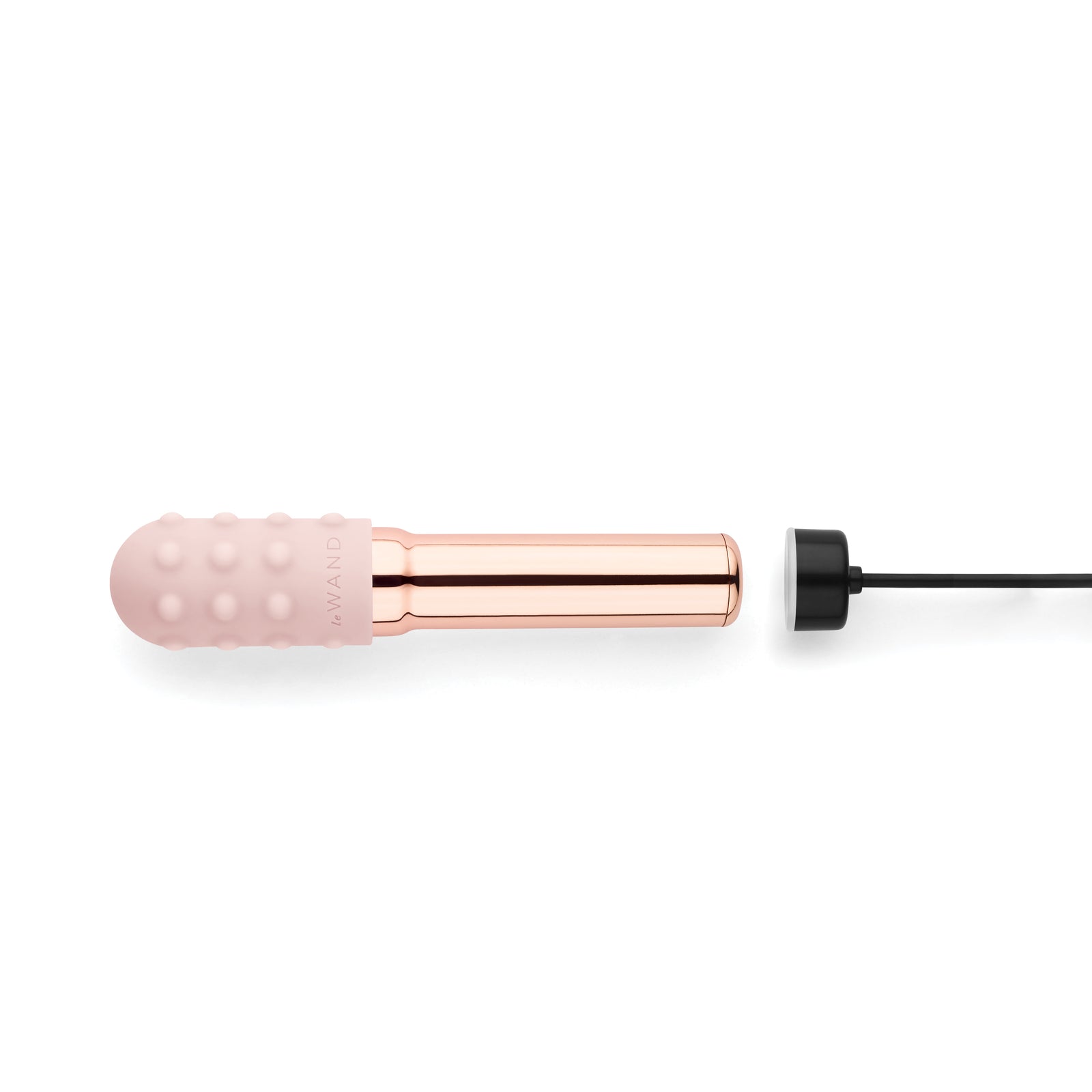  Rose gold Le Wand Grand Bullet metal vibrator standing upright, highlighting the polished chrome finish.