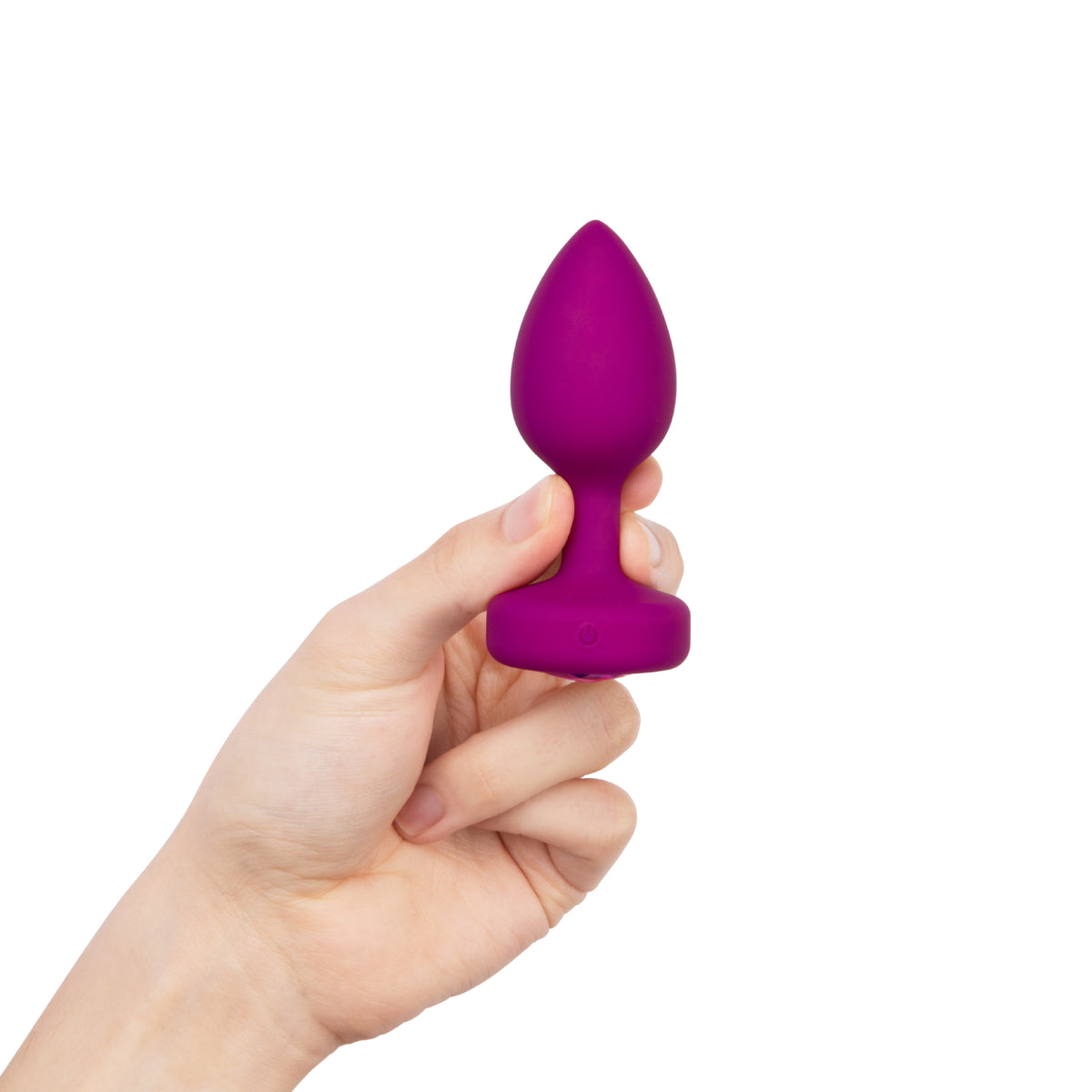 Hand holding the plug neck to show insertable size and tapered design


