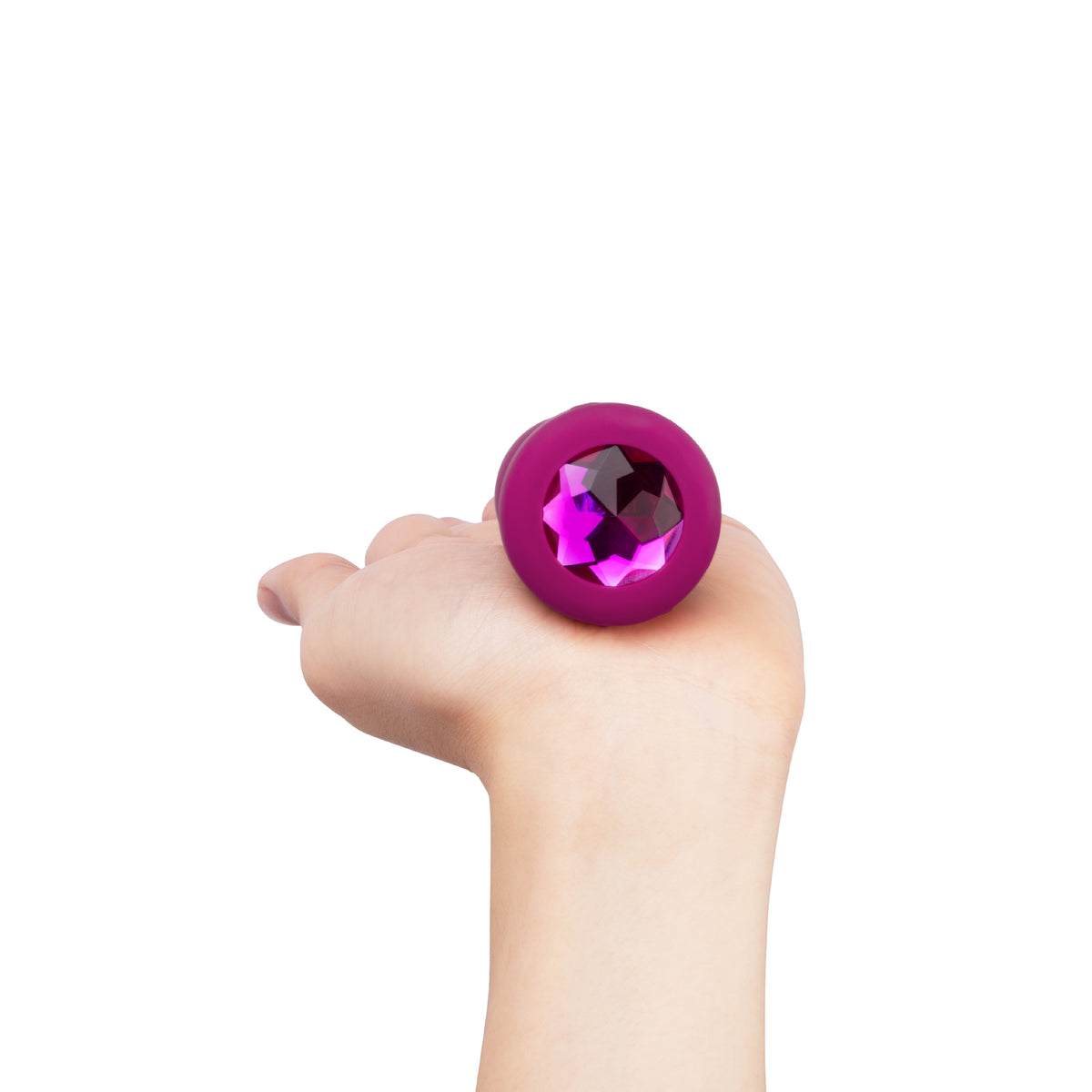 Product resting on open palm to show jeweled base design

