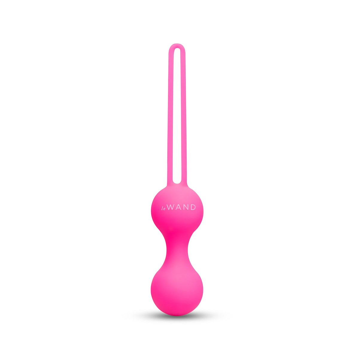 Pink kegel ball with a string on a white background