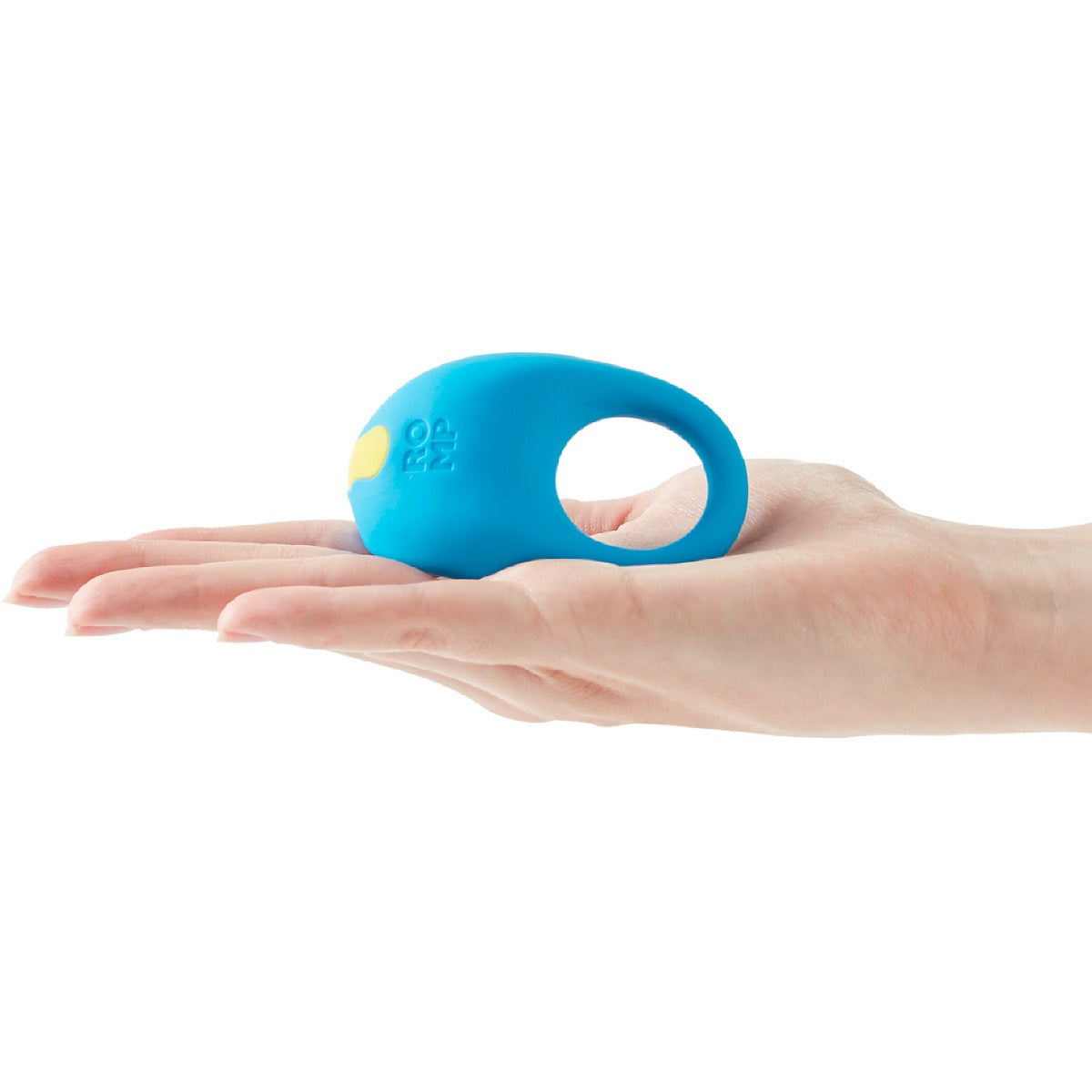 Blue ROMP Juke Rechargeable Silicone Cock Ring held in a hand on a white background