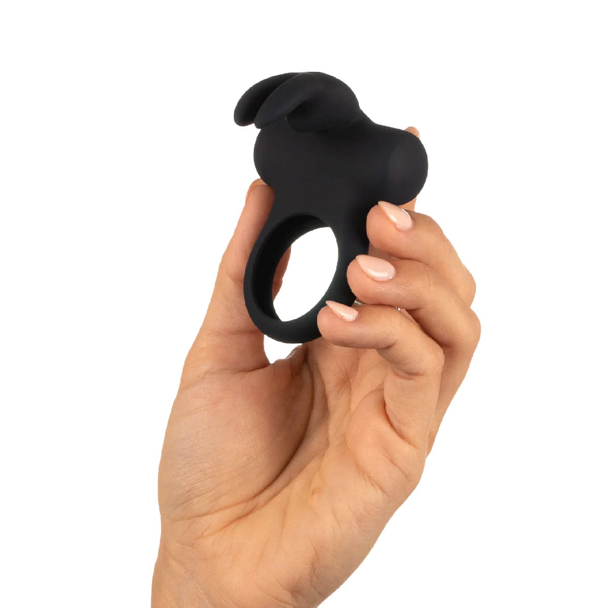 Hand holding a VeDO Frisky Bunny Rechargeable Silicone Vibrating Cock Ring against a white background